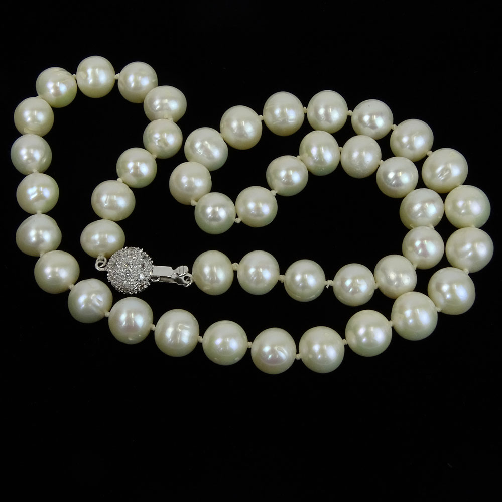 Lady's White Pearl Necklace with Diamond and 14 Karat White Gold Clasp.