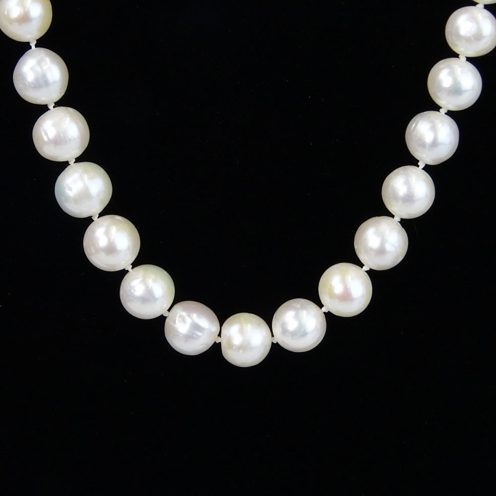 Lady's White Pearl Necklace with Diamond and 14 Karat White Gold Clasp.