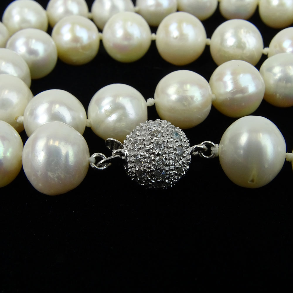 Lady's White Pearl Necklace with Diamond and 14 Karat White Gold Clasp.