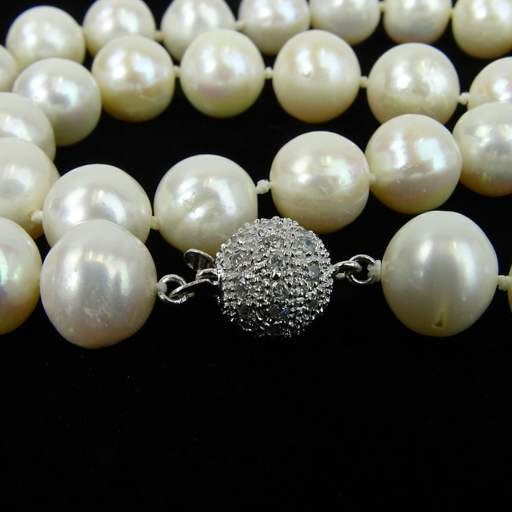 Lady's White Pearl Necklace with Diamond and 14 Karat White Gold Clasp.