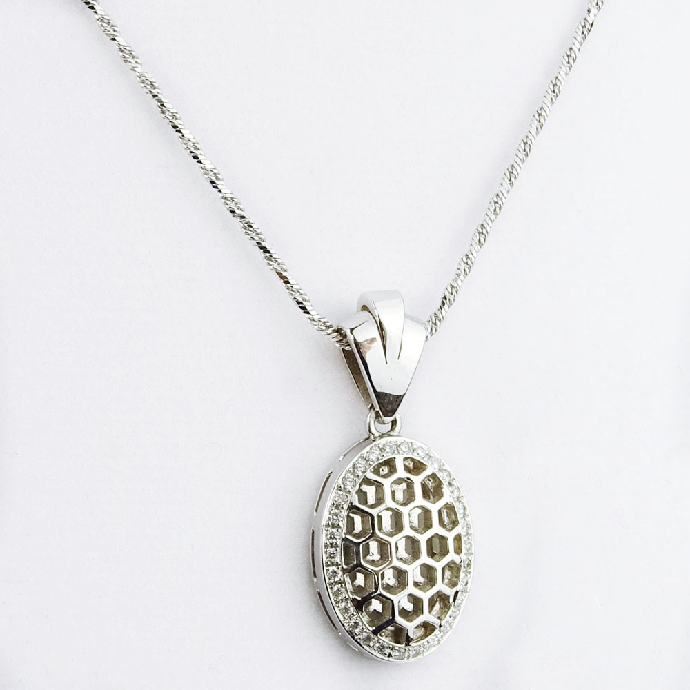 Lady's 18 Karat White Gold Pendant Necklace Accented with Small Round Cut Diamonds.