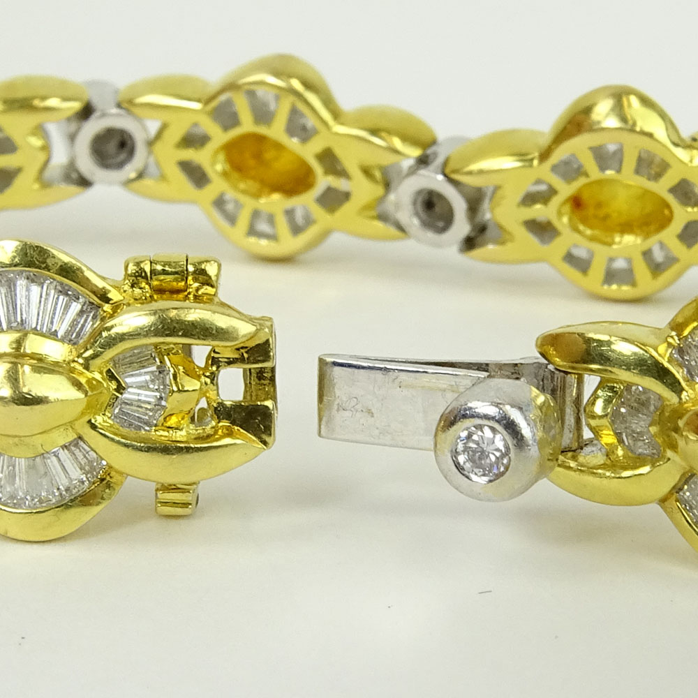 Lady's Approx. 4.50 Carat Tapered Baguette, .50 Carat Round Cut and 18 Karat Yellow and White Gold Bracelet.