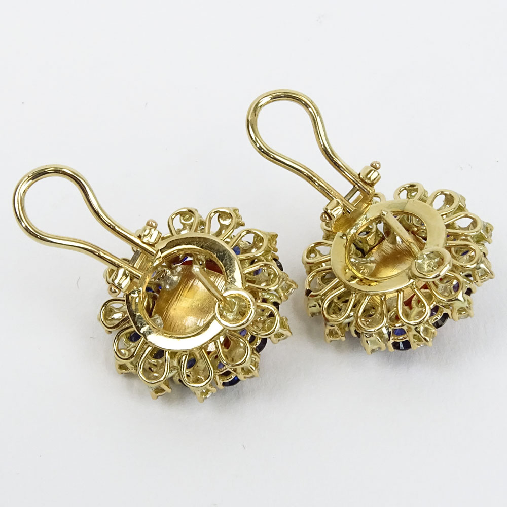 Pair of Coral, Round Cut Diamond, Sapphire and 14 Karat Yellow Gold Earrings. Sapphires with vivid saturation of color.