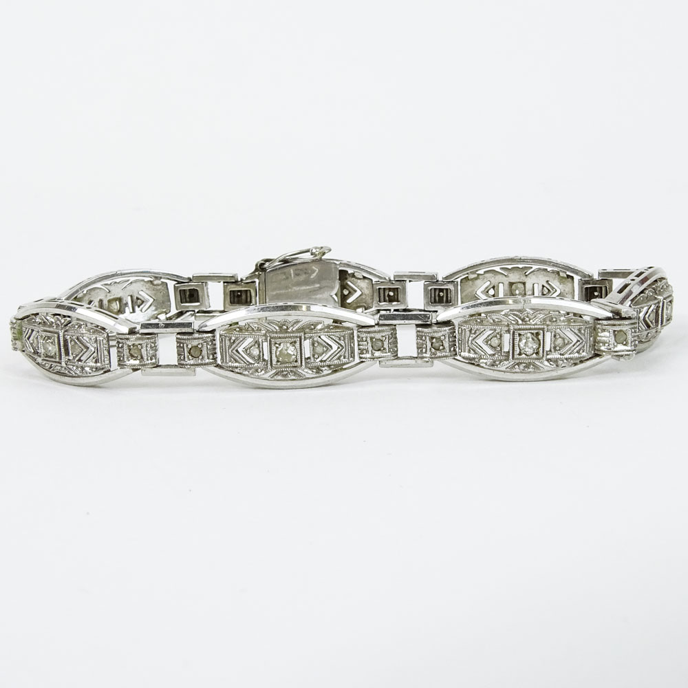 Lady's Vintage 18 Karat White Gold Filigree Bracelet with Round Cut Diamond Accents.