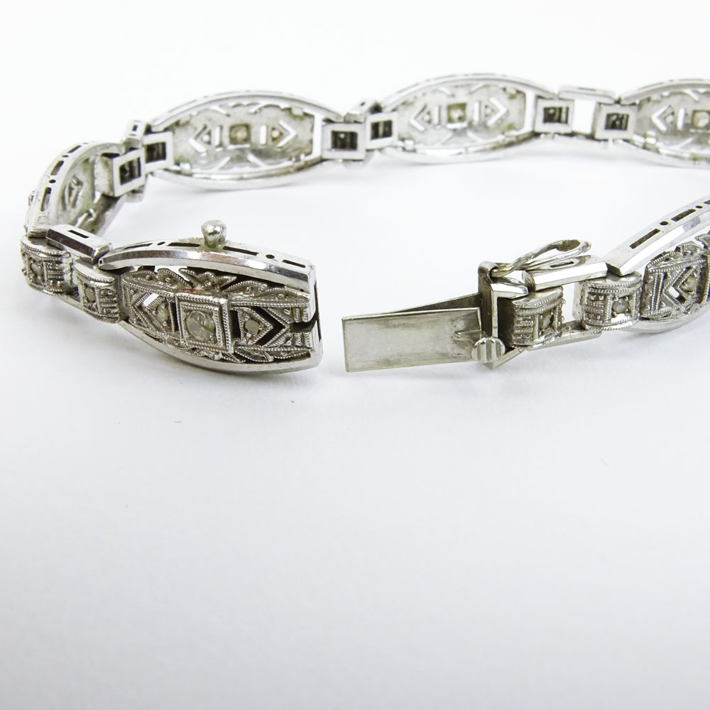 Lady's Vintage 18 Karat White Gold Filigree Bracelet with Round Cut Diamond Accents.