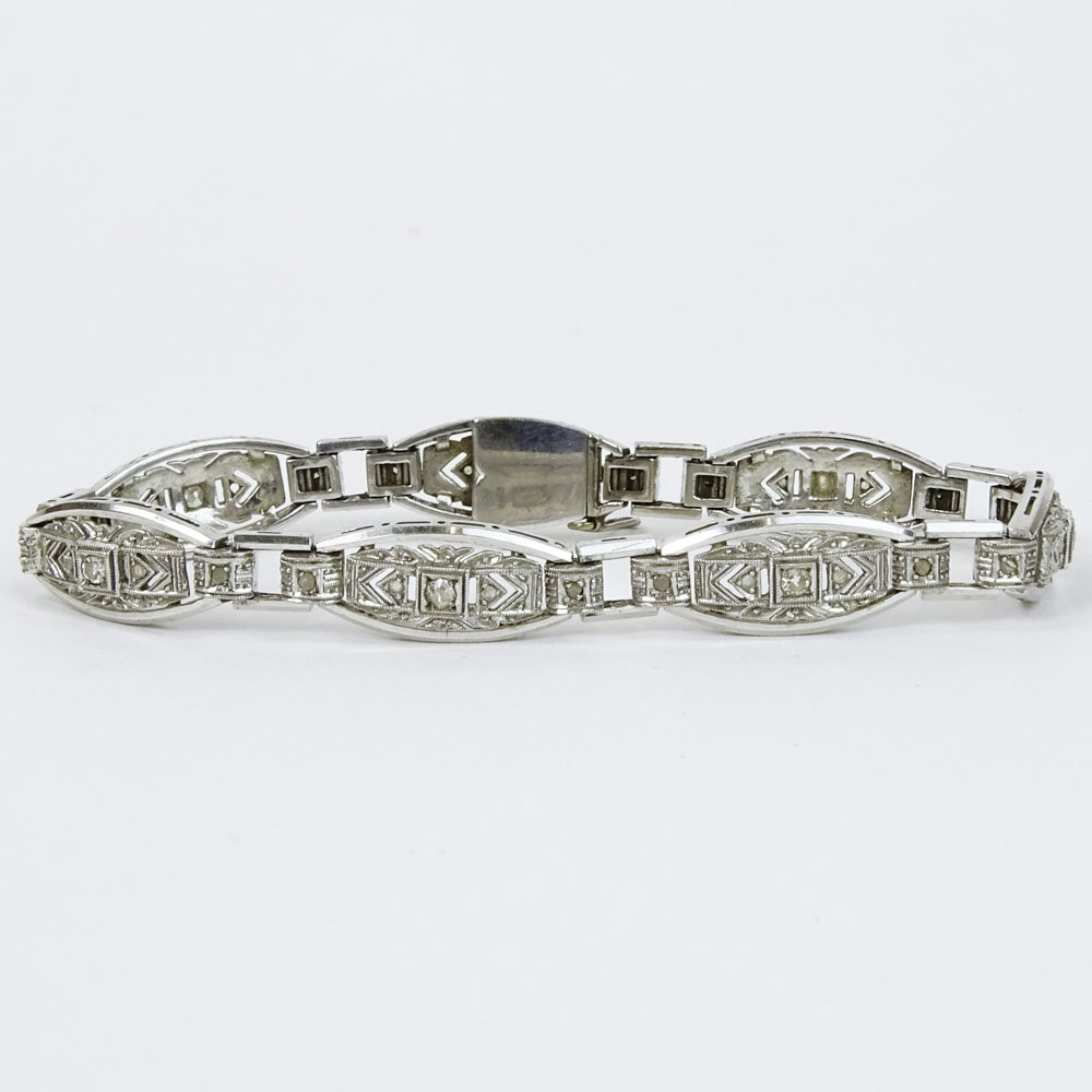 Lady's Vintage 18 Karat White Gold Filigree Bracelet with Round Cut Diamond Accents.