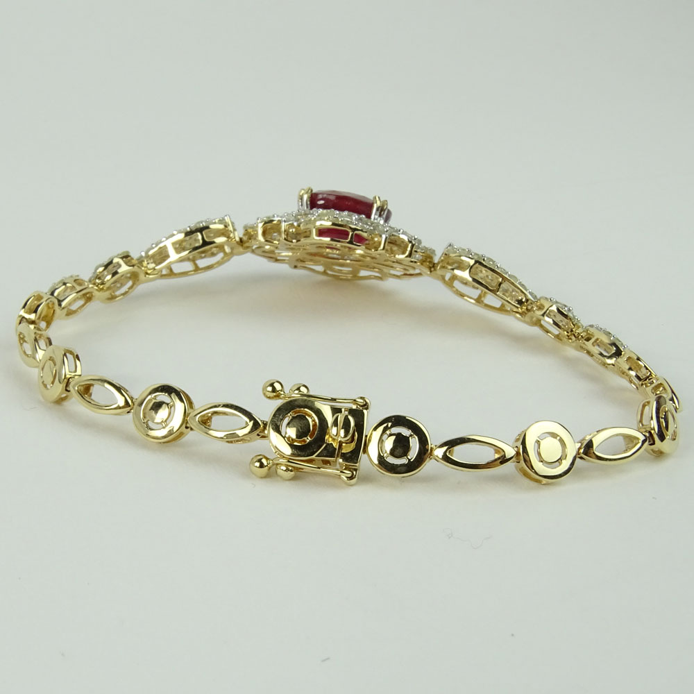 AIG Certified 6.77 Carat Oval Cut Ruby, 3.34 Carat Round Cut Diamond and 14 Karat Yellow Gold Bracelet. 