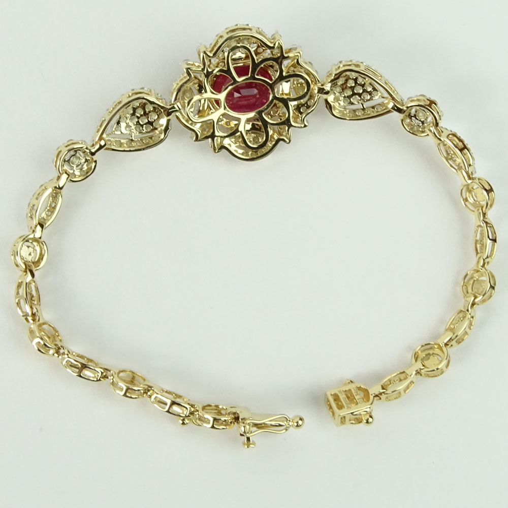 AIG Certified 6.77 Carat Oval Cut Ruby, 3.34 Carat Round Cut Diamond and 14 Karat Yellow Gold Bracelet. 