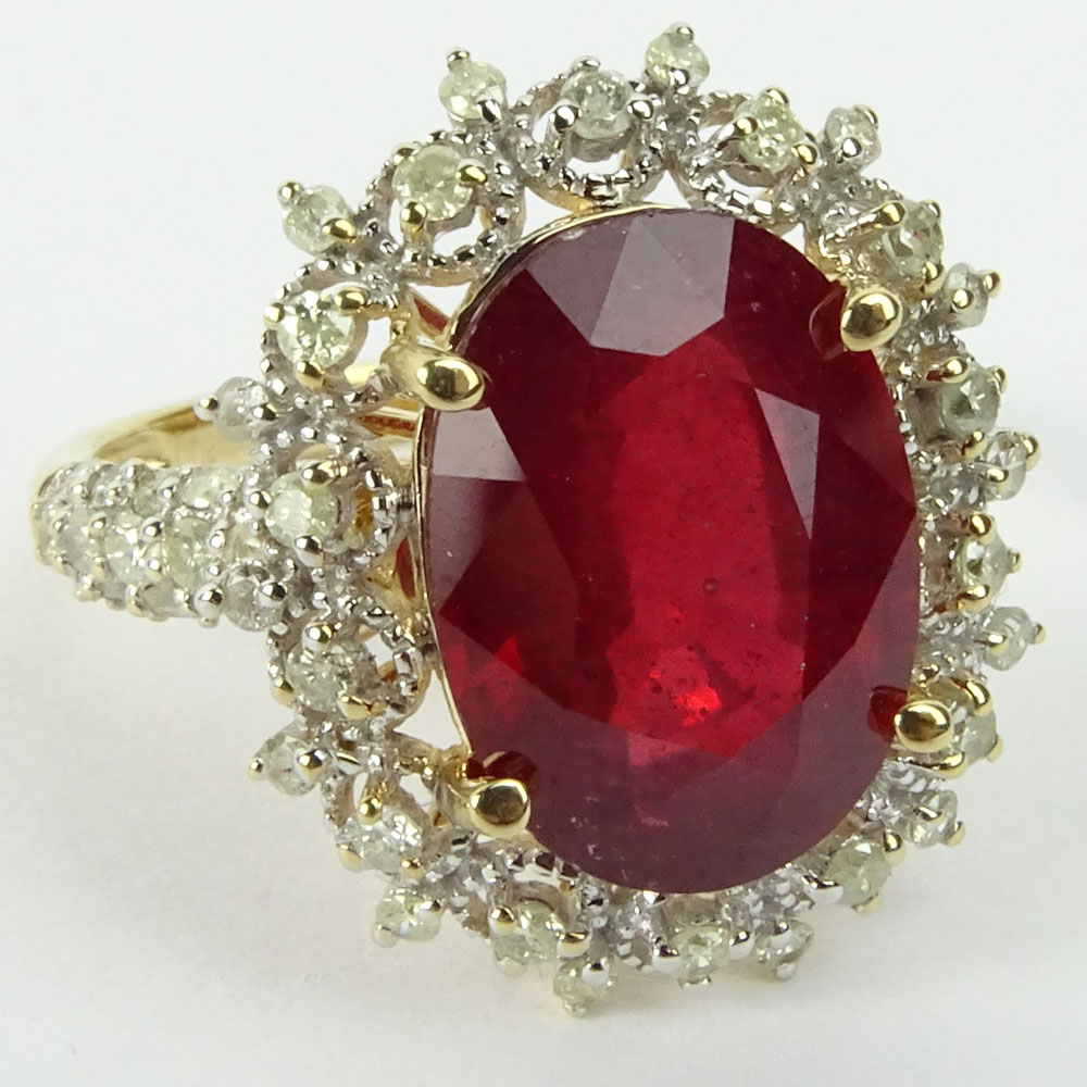 GGA Certified 7.12 Carat Oval Cut Ruby, .78 Carat Round Cut Diamond and 14 Karat Yellow Gold Ring. 