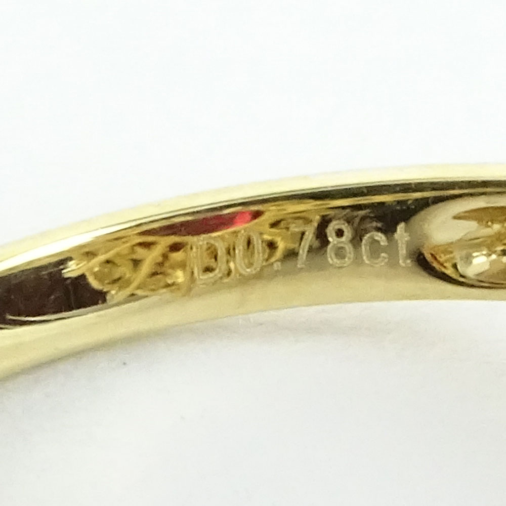 GGA Certified 7.12 Carat Oval Cut Ruby, .78 Carat Round Cut Diamond and 14 Karat Yellow Gold Ring. 