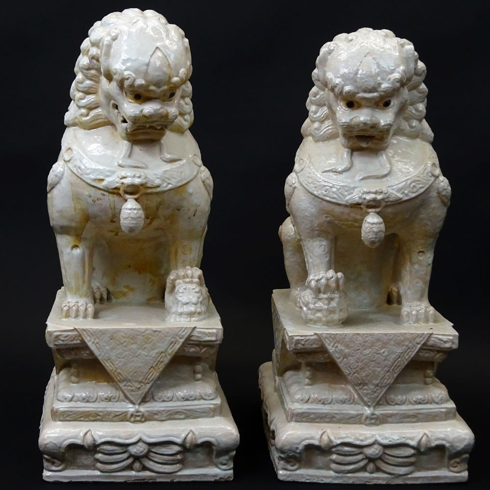 Pair Mid 20th Century Chinese Glazed Terra Cotta Foo Dogs.