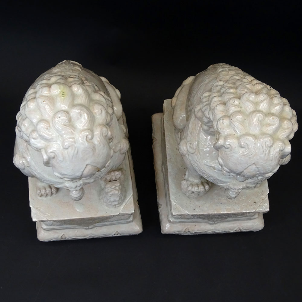Pair Mid 20th Century Chinese Glazed Terra Cotta Foo Dogs.