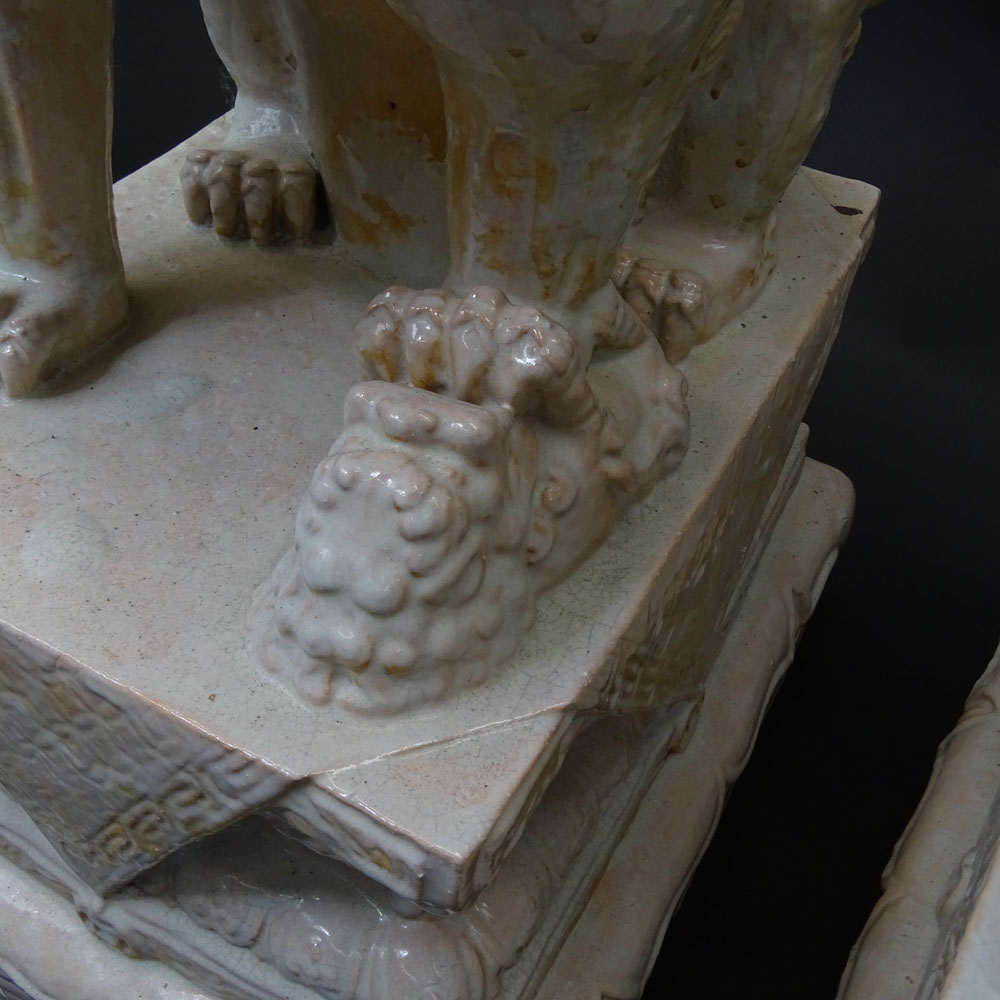 Pair Mid 20th Century Chinese Glazed Terra Cotta Foo Dogs.