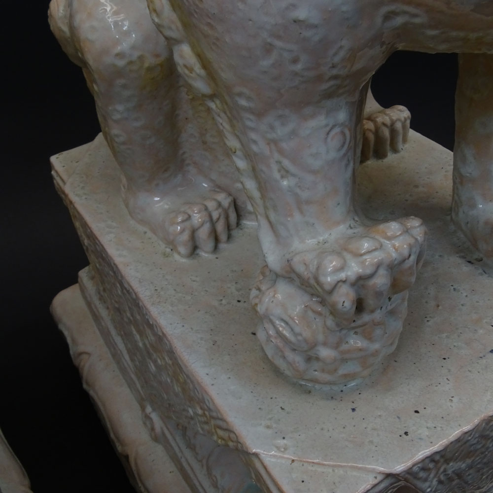 Pair Mid 20th Century Chinese Glazed Terra Cotta Foo Dogs.