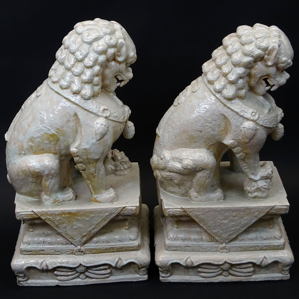 Pair Mid 20th Century Chinese Glazed Terra Cotta Foo Dogs.