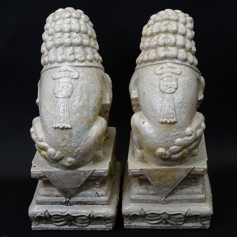 Pair Mid 20th Century Chinese Glazed Terra Cotta Foo Dogs.
