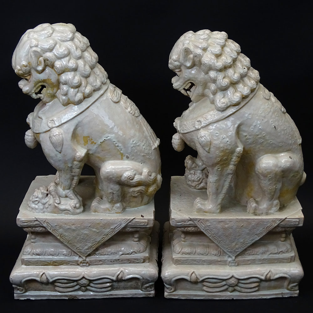 Pair Mid 20th Century Chinese Glazed Terra Cotta Foo Dogs.