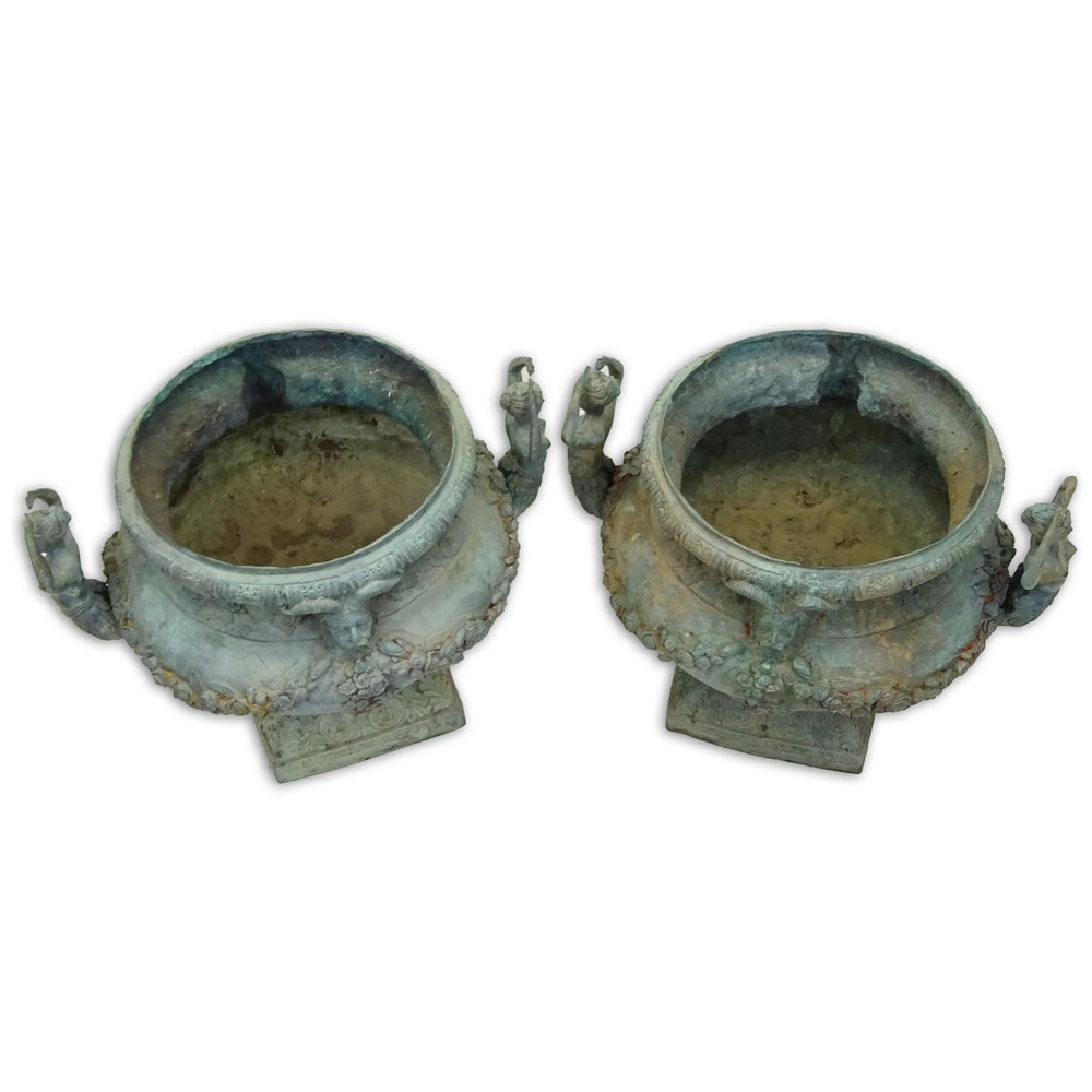 Pair of bronze jardinières with mermaid handles and figural motif.