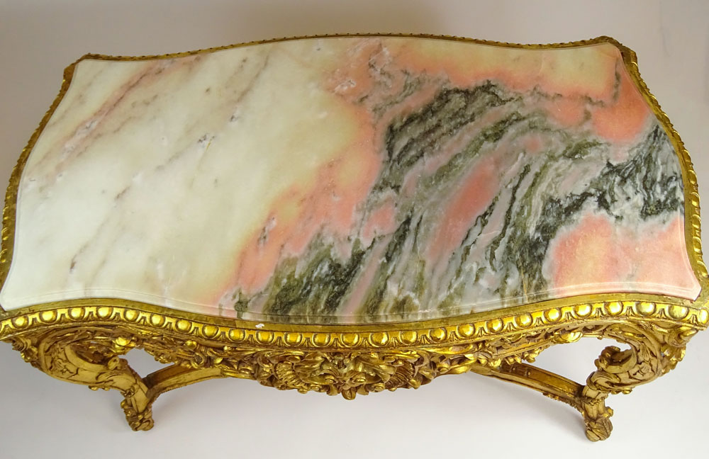 Large Rococo Style Carved and Giltwood Center Table with Marble top.