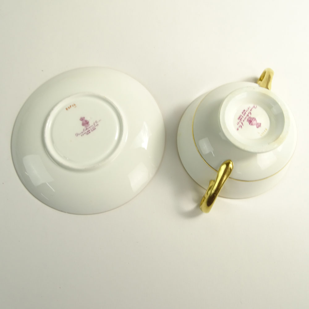 Lot of 9 Minton porcelain and gilt cream soup cups and saucers.