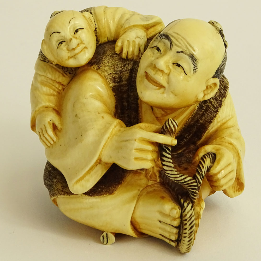 Vintage Japanese Carved Ivory Figure of a Seated Man and Boy.