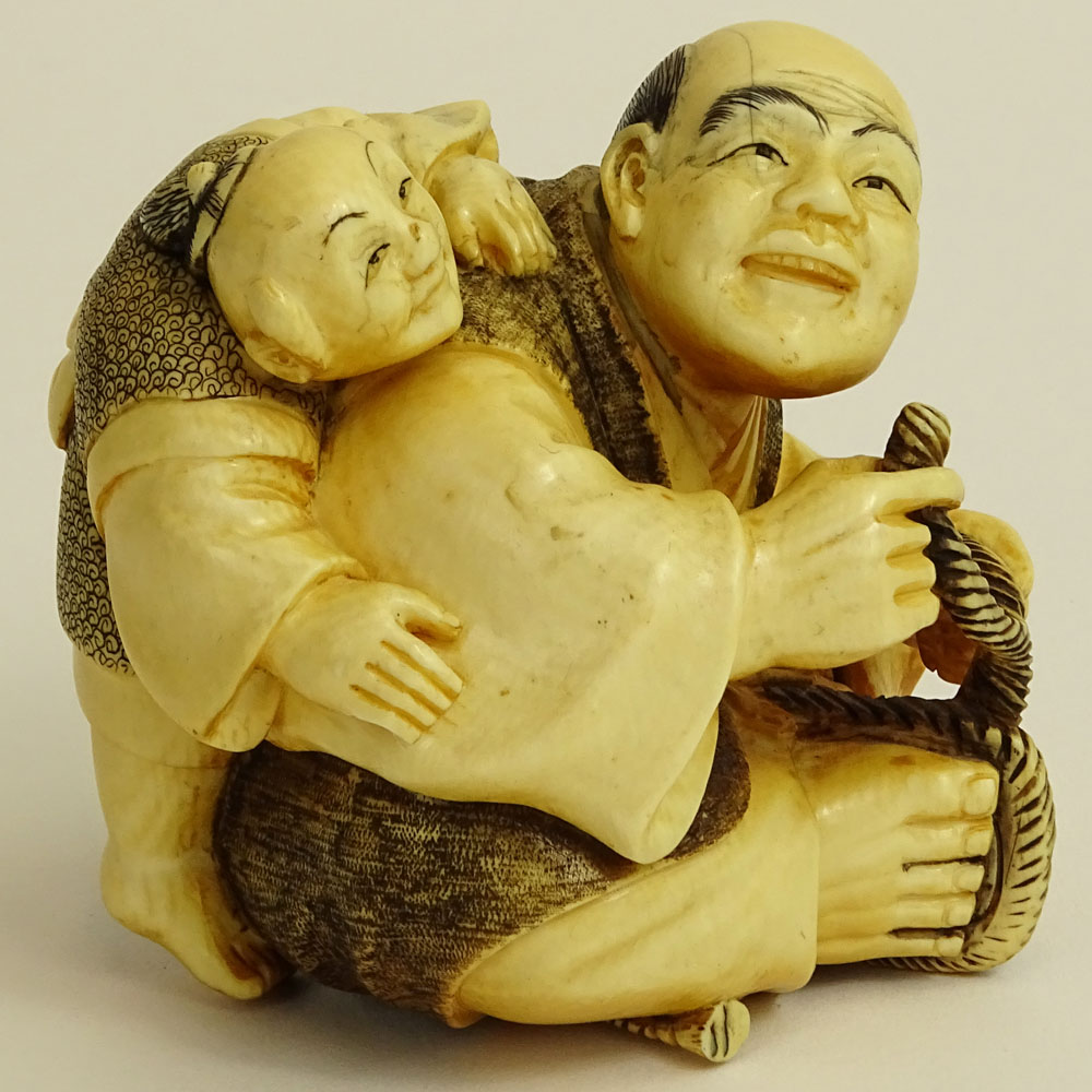 Vintage Japanese Carved Ivory Figure of a Seated Man and Boy.