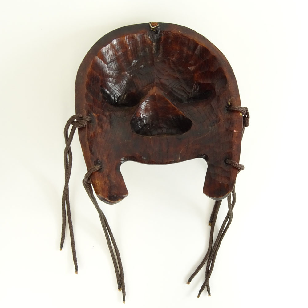 Possibly 18th century Korean carved and stained wood dance mask