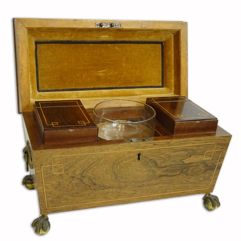 An English Regency Inlaid Rosewood Tea Caddy. Ball and claw feet, shell motif handles. 