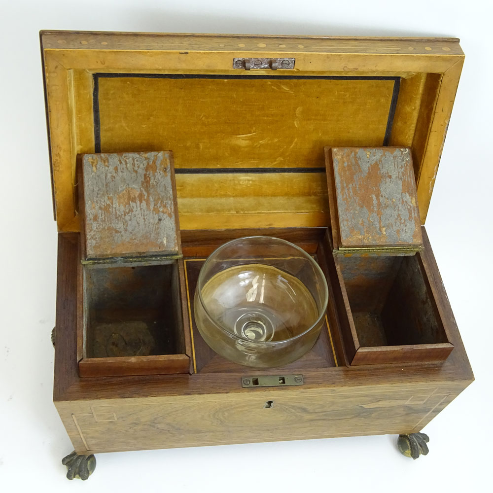 An English Regency Inlaid Rosewood Tea Caddy. Ball and claw feet, shell motif handles. 