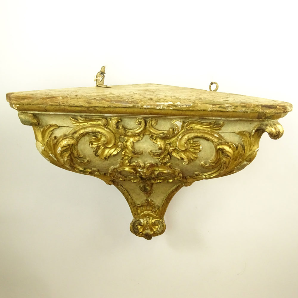 19/20th Century Probably Italian Carved Parcel Gilt Wood Wall Bracket.