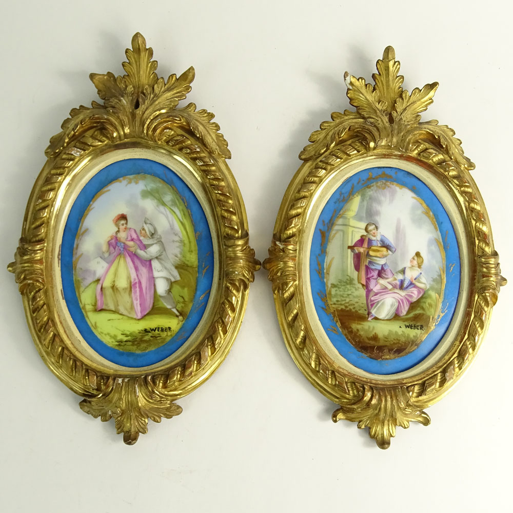 Pair of Vintage Sevres Style Hand Painted Porcelain Plaques in Carved Giltwood Frames.
