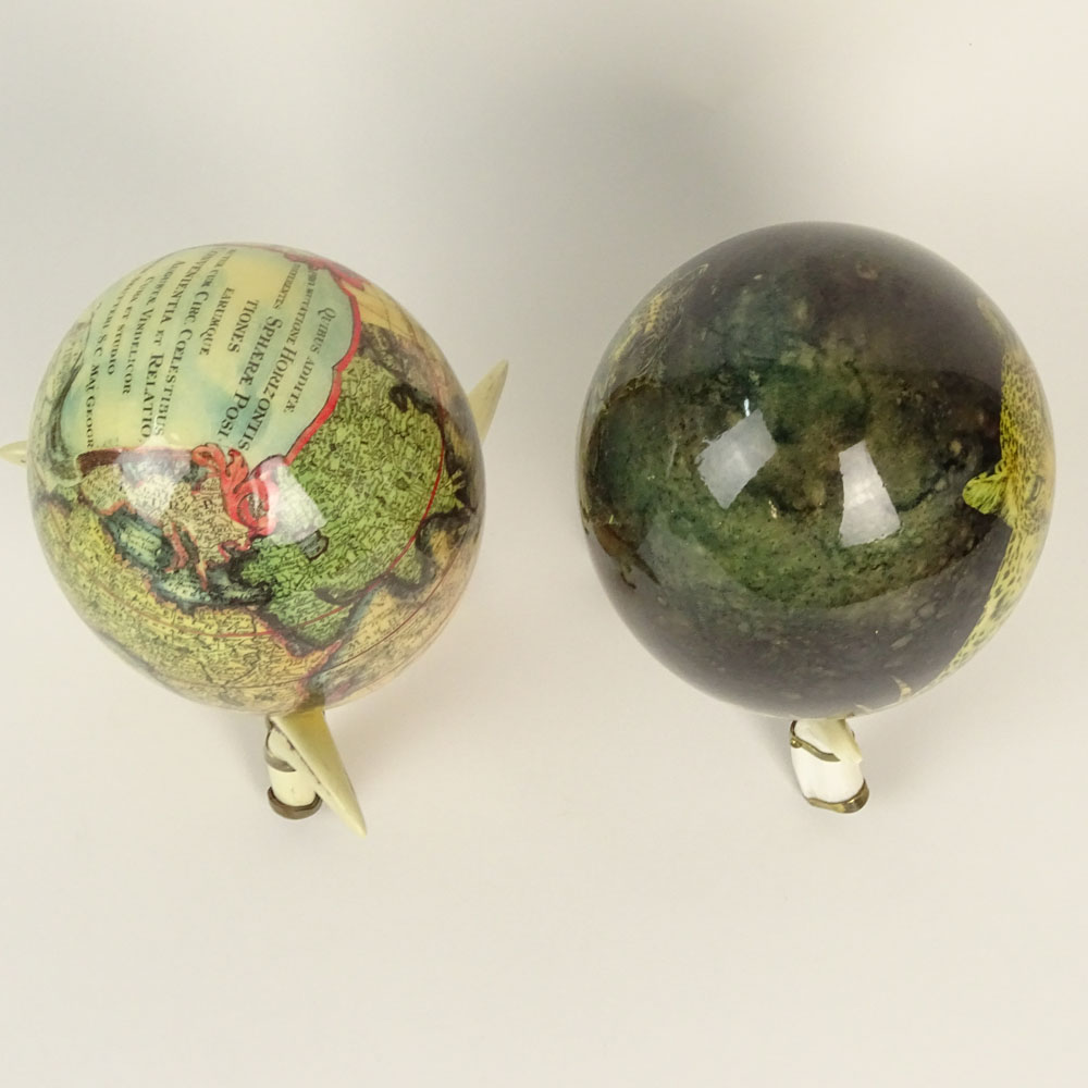 Pair of South African Decoupage Ostrich Eggs on Boar Tusk Stands.