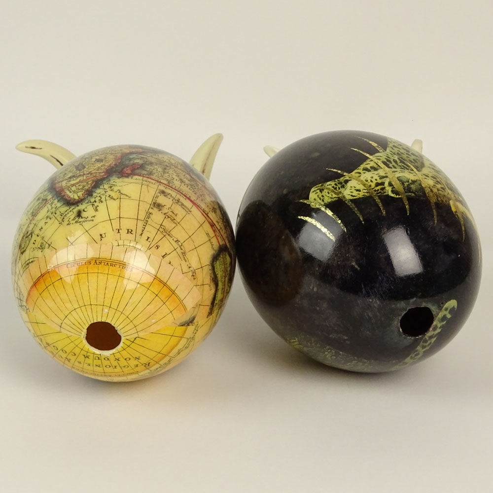 Pair of South African Decoupage Ostrich Eggs on Boar Tusk Stands.