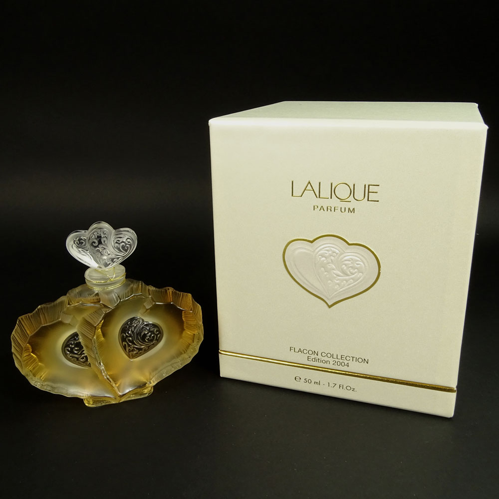 Boxed Lalique 1.7 fl. Oz Eau de Parfum Double Heart Bottle.