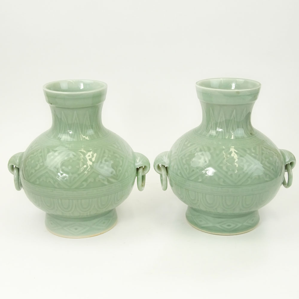 Pair of 2 Contemporary Korean Style Porcelain Figural Ring Handled Vases.