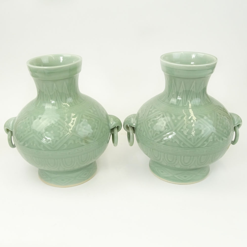 Pair of 2 Contemporary Korean Style Porcelain Figural Ring Handled Vases.