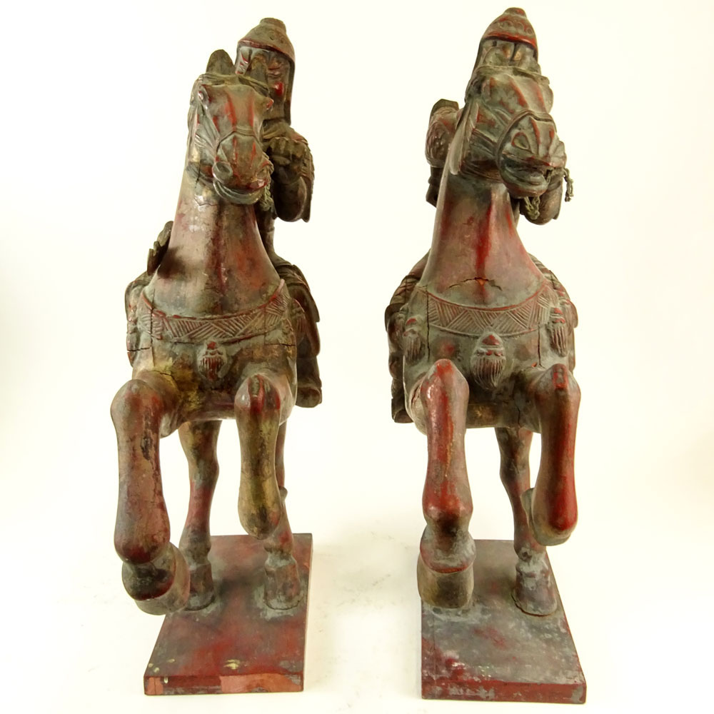 Pair of Vintage Chinese Polychromed Carved Wood Warrior Horse Riders.