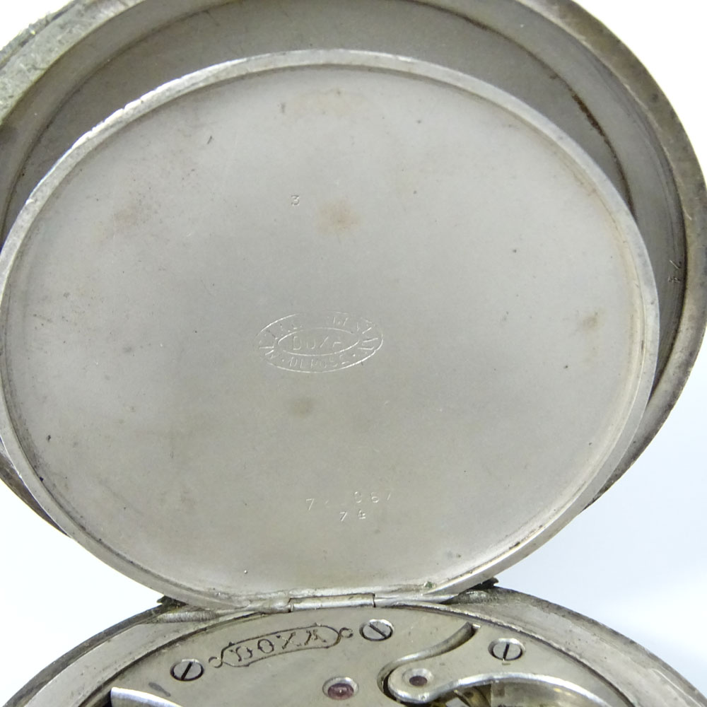 Antique Doxa Erotic Oversize Pocket watch. Chased train design on back of case.