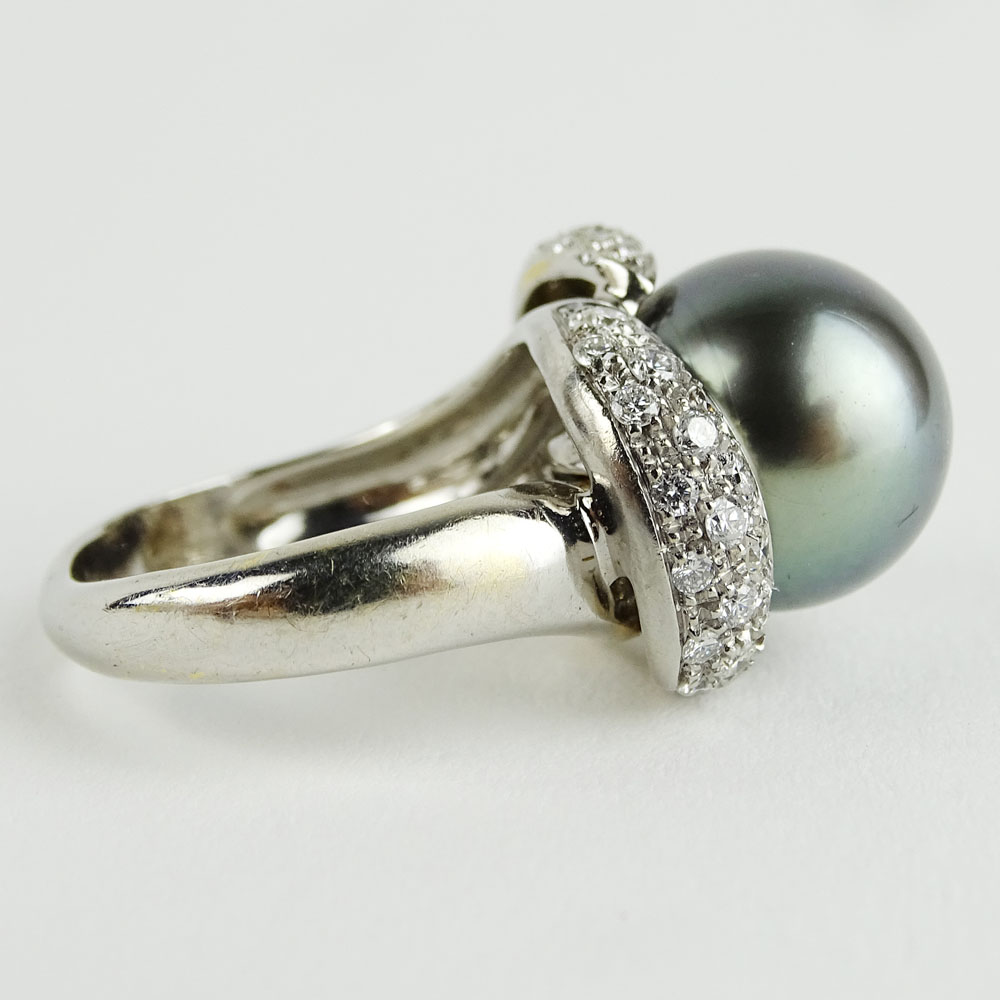 Vintage 12.5mm Tahitain Black Pearl, 1.0 Carat Pave Set Round Cut Diamond and 14 Karat White Gold Ring. 