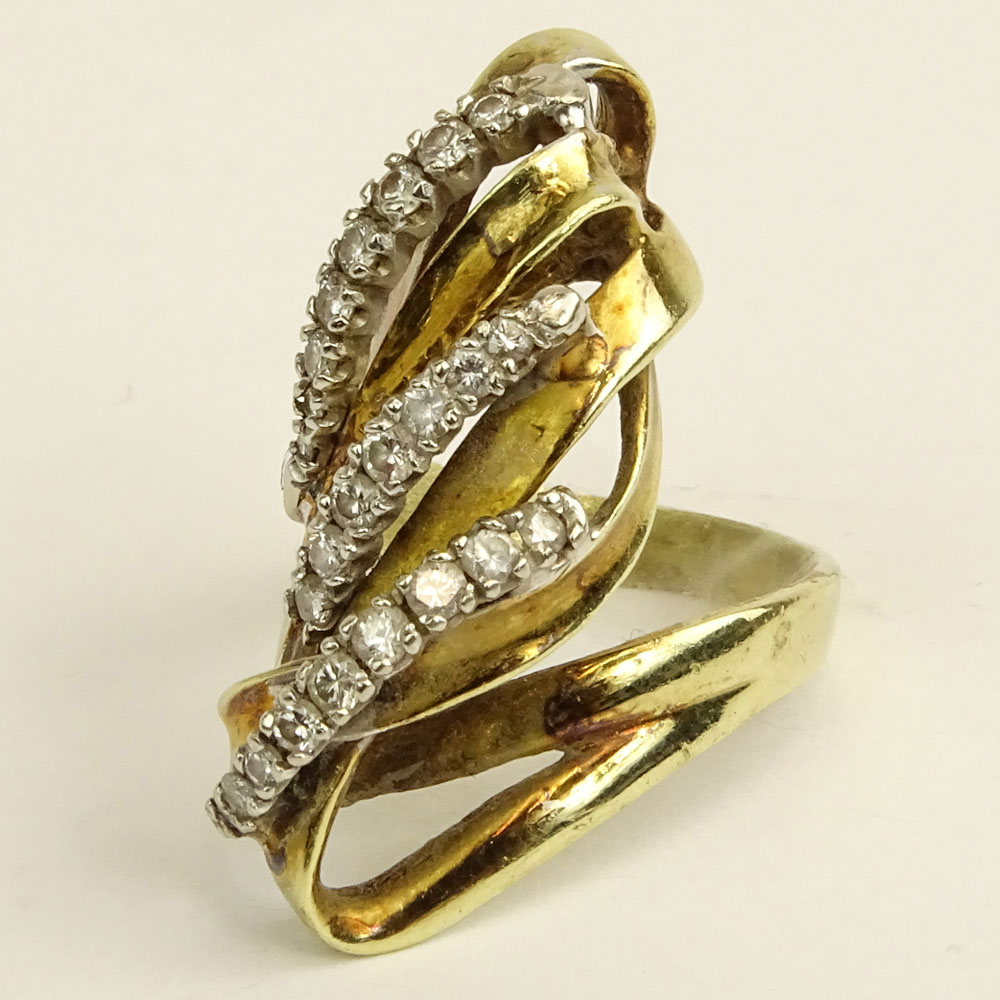 Lady's Vintage 14 Karat Yellow Gold Ring accented with small round cut diamonds.