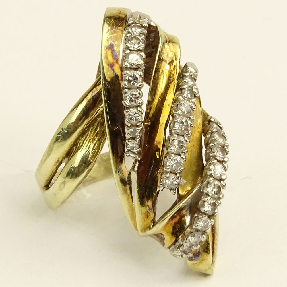 Lady's Vintage 14 Karat Yellow Gold Ring accented with small round cut diamonds.