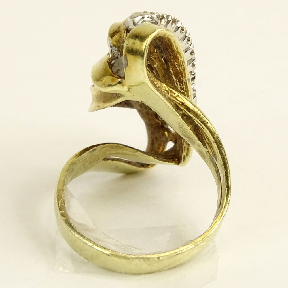 Lady's Vintage 14 Karat Yellow Gold Ring accented with small round cut diamonds.