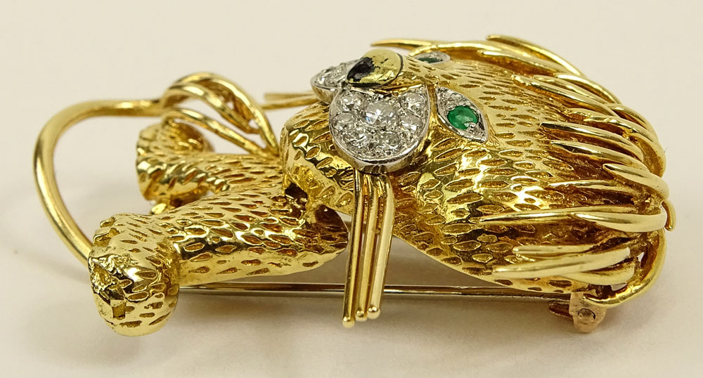 Circa 1960's Van Cleef and Arpels 18 Karat Yellow Gold, Diamond, Emerald and Enamel Lion Brooch.