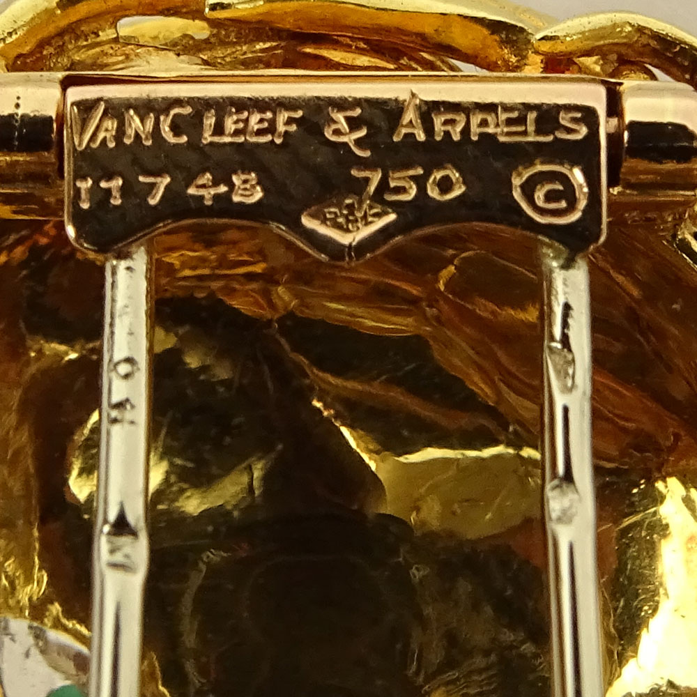 Circa 1960's Van Cleef and Arpels 18 Karat Yellow Gold, Diamond, Emerald and Enamel Lion Brooch.