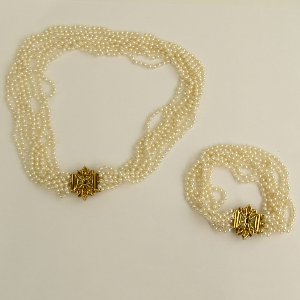 Multi Strand White Pearl Necklace and Bracelet Suite each with 18 Karat Yellow Gold and Diamond Clasp.