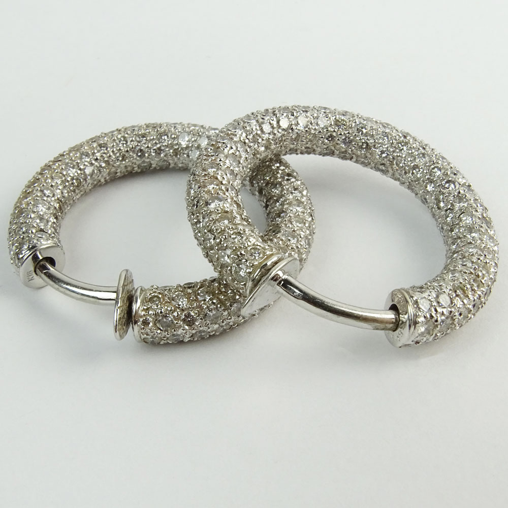 Impressive Pair of 13.80 Carat Pave Set Round Cut Diamond and 18 Karat White Gold Hoop Earrings.