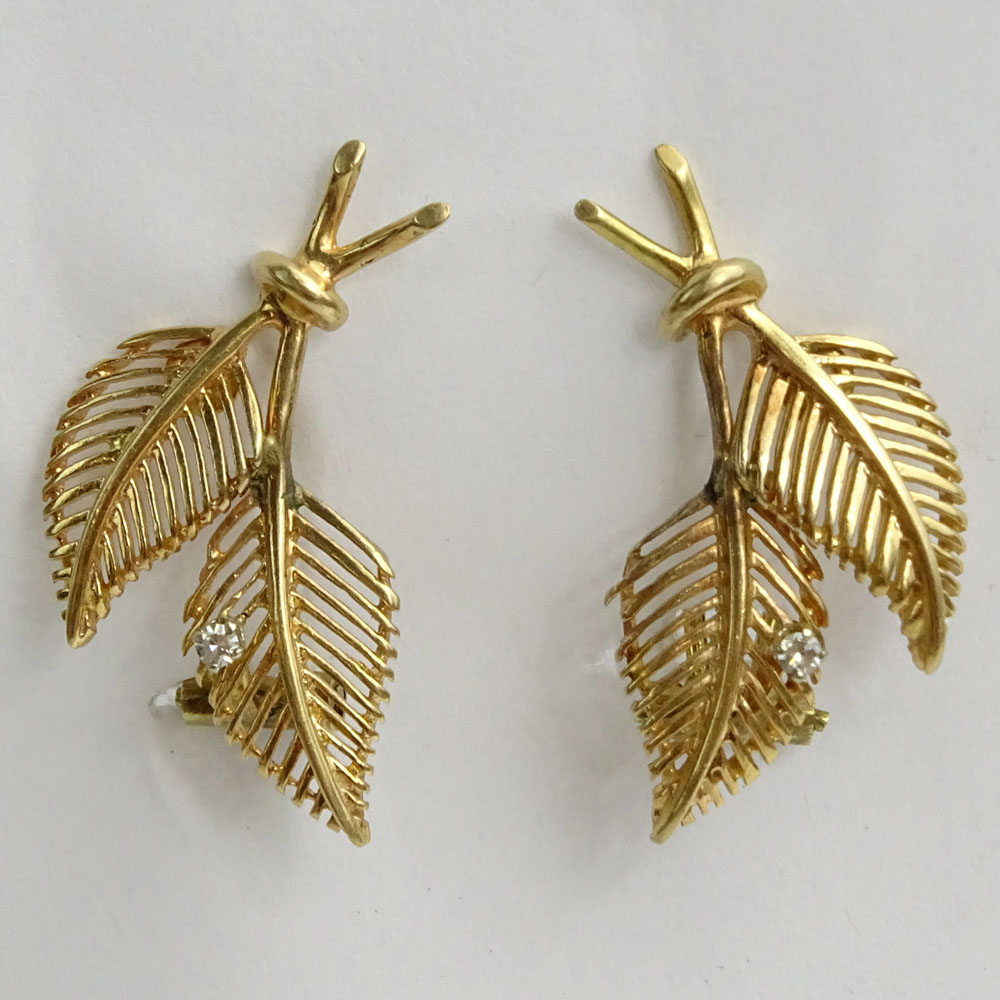 Pair of Vintage 14 Karat Yellow Gold Leaf Earrings each accented with a small round cut diamond.
