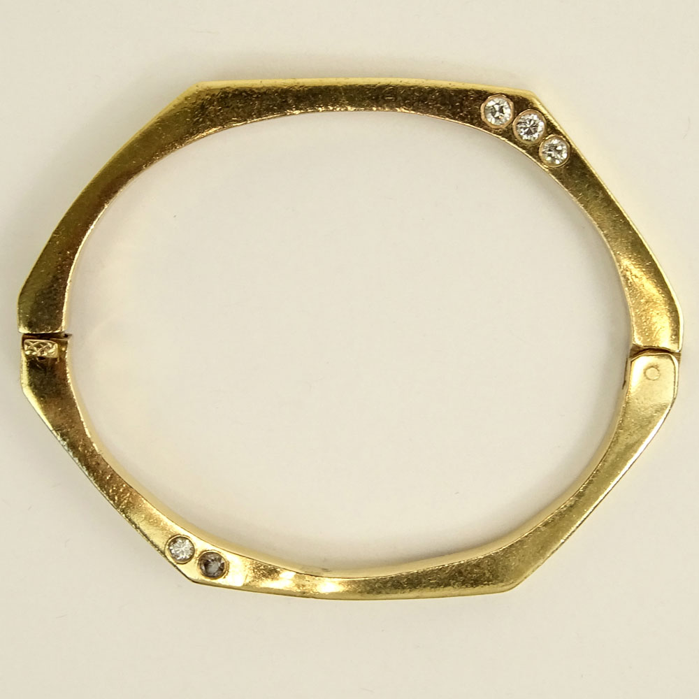 Vintage 14 Karat Yellow Gold Bangle Bracelet accented with Ten (10) Round Cut Diamonds.