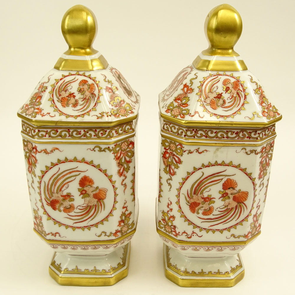 Pair of French Porcelain Hand Decorated Covered Footed Jars.