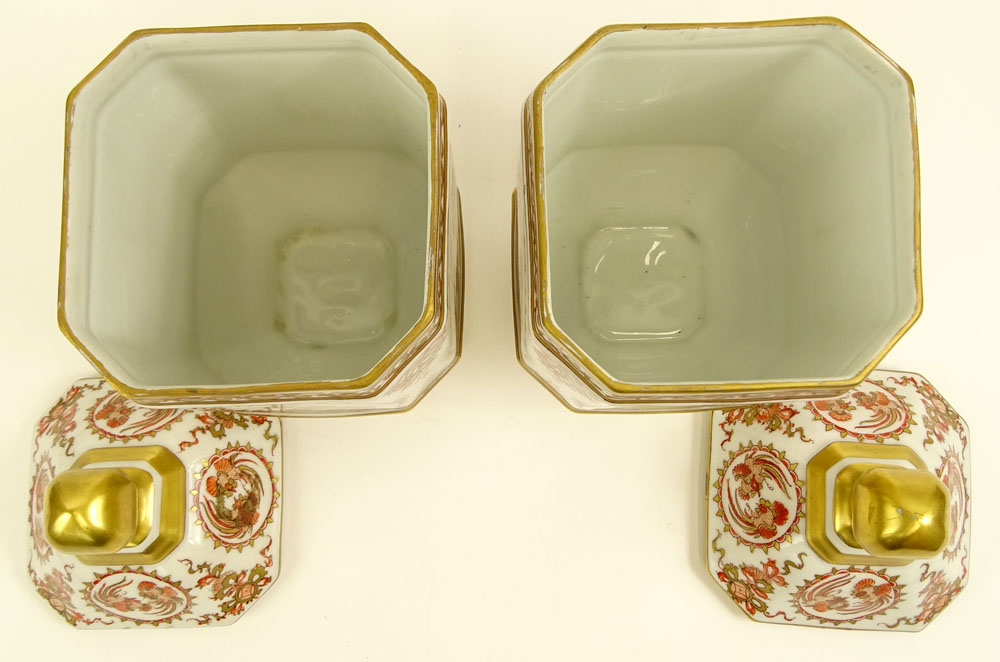 Pair of French Porcelain Hand Decorated Covered Footed Jars.